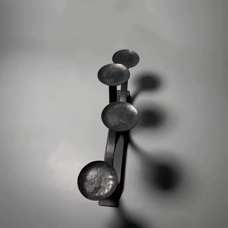 🌟 🌟Four curved metal candlesticks, featuring a typical retro industrial design